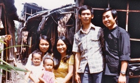 My parents, sisters, and others on their boat at the Thai refugee camp.