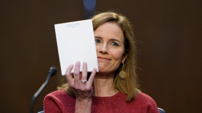 A picture of Amy Coney Barrett holding up her blank notepad during her confirmation hearings.