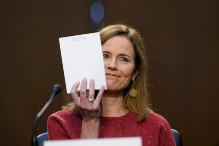 A picture of Amy Coney Barrett holding up her blank notepad during her confirmation hearings.
