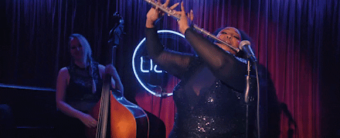 Lizzo mic dropping her flute