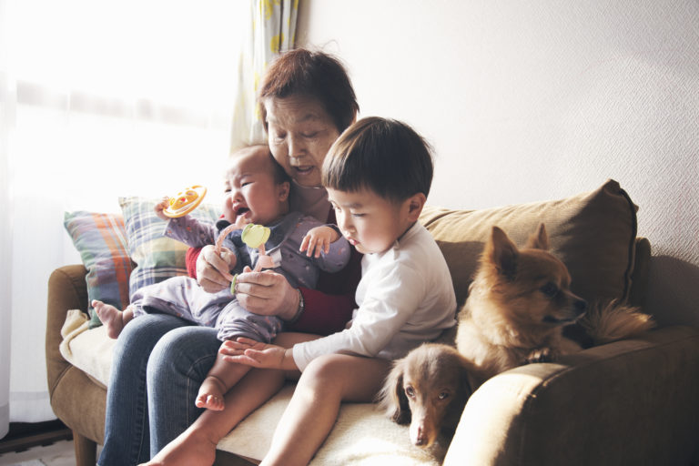 Grandmother and grandchildren at home