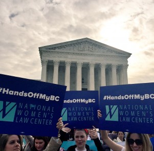 Protestors with signs reading "Hands off my BC" gather to defend birth control coverage outside the Supreme Court