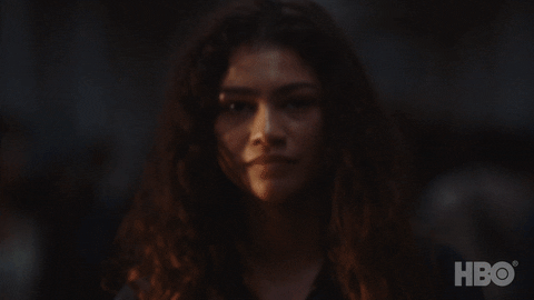 gif of Rue slowly smiling